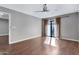 Bright bedroom with hardwood floors and sliding door to balcony at 16616 E Palisades Blvd # 102, Fountain Hills, AZ 85268