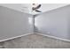 Well-lit bedroom featuring carpet and a ceiling fan at 16616 E Palisades Blvd # 102, Fountain Hills, AZ 85268