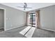 Bright bedroom with carpet, ceiling fan and sliding glass door at 16616 E Palisades Blvd # 102, Fountain Hills, AZ 85268