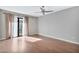 Bright bedroom with hardwood floors and sliding door to balcony at 16616 E Palisades Blvd # 102, Fountain Hills, AZ 85268