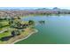 Scenic lakefront view with mountain backdrop at 16616 E Palisades Blvd # 102, Fountain Hills, AZ 85268