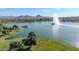 Aerial view of a lake with fountain and mountain backdrop at 16616 E Palisades Blvd # 102, Fountain Hills, AZ 85268