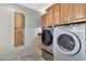 Laundry room with stacked washer and dryer and storage at 16616 E Palisades Blvd # 102, Fountain Hills, AZ 85268