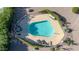 Aerial view of a community pool with lounge chairs at 16616 E Palisades Blvd # 102, Fountain Hills, AZ 85268