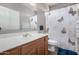 Bathroom with single vanity and butterfly shower curtain at 17395 W Straight Arrow Ln, Surprise, AZ 85387