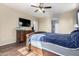 Spacious bedroom with wood floors and ceiling fan at 17395 W Straight Arrow Ln, Surprise, AZ 85387