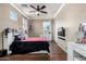 Bedroom with queen-size bed and plenty of natural light at 17395 W Straight Arrow Ln, Surprise, AZ 85387