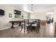 Bright dining room with a table, chairs, and game table at 17395 W Straight Arrow Ln, Surprise, AZ 85387