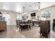 Spacious dining area with a large table and access to the kitchen at 17395 W Straight Arrow Ln, Surprise, AZ 85387