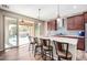 Kitchen with granite countertops, stainless steel appliances, and a view of the backyard pool at 17395 W Straight Arrow Ln, Surprise, AZ 85387
