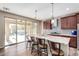 Kitchen boasts granite countertops, stainless steel appliances, and backyard access at 17395 W Straight Arrow Ln, Surprise, AZ 85387