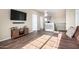 Spacious loft area with a sofa and flat-screen TV at 17395 W Straight Arrow Ln, Surprise, AZ 85387