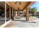 Covered patio with seating area and pool view at 17395 W Straight Arrow Ln, Surprise, AZ 85387
