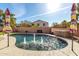 Inviting kidney-shaped pool with water features, spa, and ample patio space at 17395 W Straight Arrow Ln, Surprise, AZ 85387