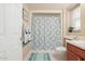 Clean bathroom with shower/tub combo and wood vanity at 17806 N 130Th Ave, Sun City West, AZ 85375