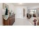 Entryway with a wooden console table and decorative items at 17806 N 130Th Ave, Sun City West, AZ 85375