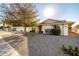 House exterior with a tree and gravel landscaping at 17806 N 130Th Ave, Sun City West, AZ 85375