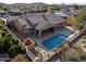 Aerial view of house with pool and surrounding landscape at 18088 W Narramore Rd, Goodyear, AZ 85338