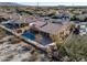 Aerial view of house with pool and backyard, mountain views at 18088 W Narramore Rd, Goodyear, AZ 85338