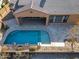 Aerial view showcasing house, pool, and backyard patio at 18088 W Narramore Rd, Goodyear, AZ 85338