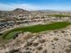 Aerial view of golf course and neighborhood at 18088 W Narramore Rd, Goodyear, AZ 85338