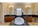 Luxurious bathroom boasting double vanities and a free-standing tub at 18088 W Narramore Rd, Goodyear, AZ 85338