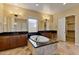 Spacious bathroom with double sinks, a soaking tub, and a large closet at 18088 W Narramore Rd, Goodyear, AZ 85338