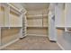Large walk-in closet with ample shelving and hanging space at 18088 W Narramore Rd, Goodyear, AZ 85338