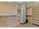 Spacious walk-in closet, built-in shelves and drawers at 18088 W Narramore Rd, Goodyear, AZ 85338
