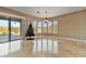 Bright dining room with large windows and chandelier at 18088 W Narramore Rd, Goodyear, AZ 85338