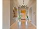 Bright and spacious entryway with high ceilings and elegant chandelier at 18088 W Narramore Rd, Goodyear, AZ 85338