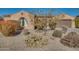 Single-story home with desert landscaping and a two-car garage at 18088 W Narramore Rd, Goodyear, AZ 85338