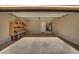 Attached garage with extra storage shelving at 18088 W Narramore Rd, Goodyear, AZ 85338