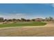 View of a lush green golf course at 18088 W Narramore Rd, Goodyear, AZ 85338