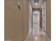 Spacious hallway with tile floors and neutral tones at 18088 W Narramore Rd, Goodyear, AZ 85338