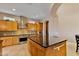 Island kitchen with stainless steel appliances and ample counter space at 18088 W Narramore Rd, Goodyear, AZ 85338