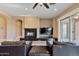 Comfortable living room with fireplace and built-in TV at 18088 W Narramore Rd, Goodyear, AZ 85338