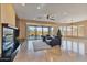 Spacious living area with fireplace and access to backyard at 18088 W Narramore Rd, Goodyear, AZ 85338