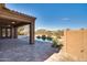 Covered patio overlooks a sparkling pool, ideal for summer relaxation at 18088 W Narramore Rd, Goodyear, AZ 85338