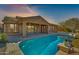 Expansive backyard oasis featuring a large pool and patio at 18088 W Narramore Rd, Goodyear, AZ 85338