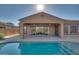 Enjoy the refreshing pool and spacious patio perfect for outdoor entertaining at 18088 W Narramore Rd, Goodyear, AZ 85338