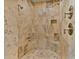 Large walk-in shower with tile surround and built-in seat at 18088 W Narramore Rd, Goodyear, AZ 85338