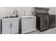 Laundry room with washer, dryer, and sink at 20034 N 273Rd Ln, Buckeye, AZ 85396