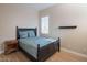 Guest bedroom with double bed and wood flooring at 2029 W Tallgrass Trl, Phoenix, AZ 85085