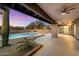 Relaxing patio with a view of the pool and desert landscape at 34642 N 52Nd St, Cave Creek, AZ 85331