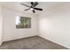 Spacious bedroom with large window and ceiling fan at 3956 E Tanzanite Ln, San Tan Valley, AZ 85143