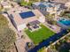 Aerial view showcasing the home's backyard oasis, complete with a pool and pergola at 4277 E Blue Sage Ct, Gilbert, AZ 85297