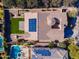 An overhead view of a house, highlighting the backyard, pool, and solar panels at 4277 E Blue Sage Ct, Gilbert, AZ 85297