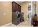 Convenient laundry room with washer, dryer, and cabinets at 4277 E Blue Sage Ct, Gilbert, AZ 85297