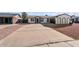 Newly remodeled home with a large driveway and a well-maintained yard at 6423 W Catalina Dr, Phoenix, AZ 85033